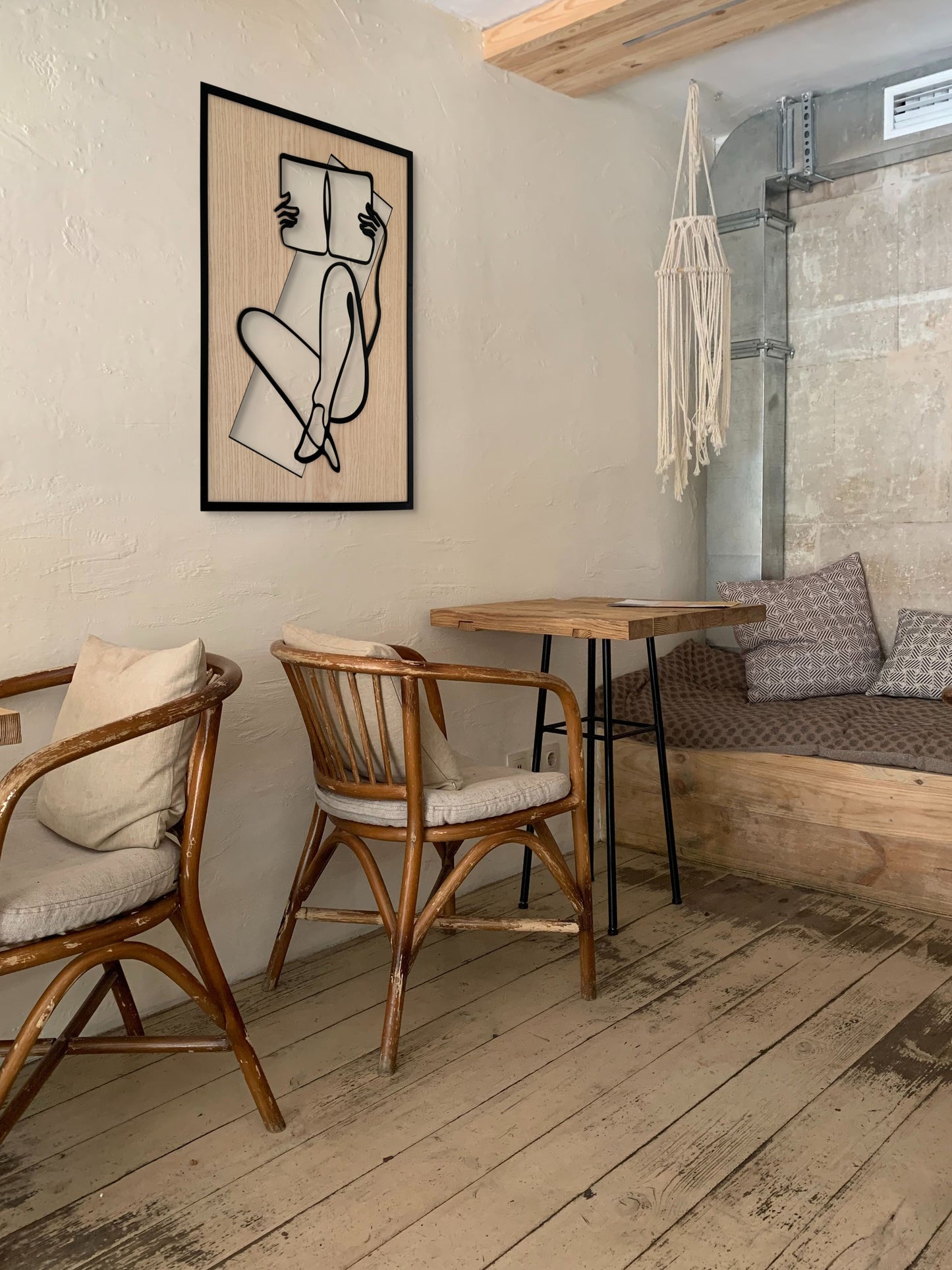 Chapter One wall art in one-line art style featuring a woman reading a book, drawn with minimalist black lines and natural wood tones. Perfect for book lovers, modern, and minimalist decor.