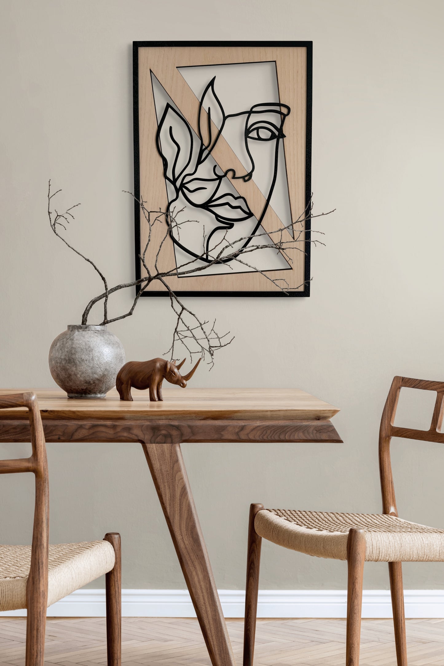 Leafed Gaze wall art in one-line art style featuring a woman’s face partially veiled by three delicate leaves, using minimalist black lines and natural wood tones. Perfect for nature-inspired, modern decor.