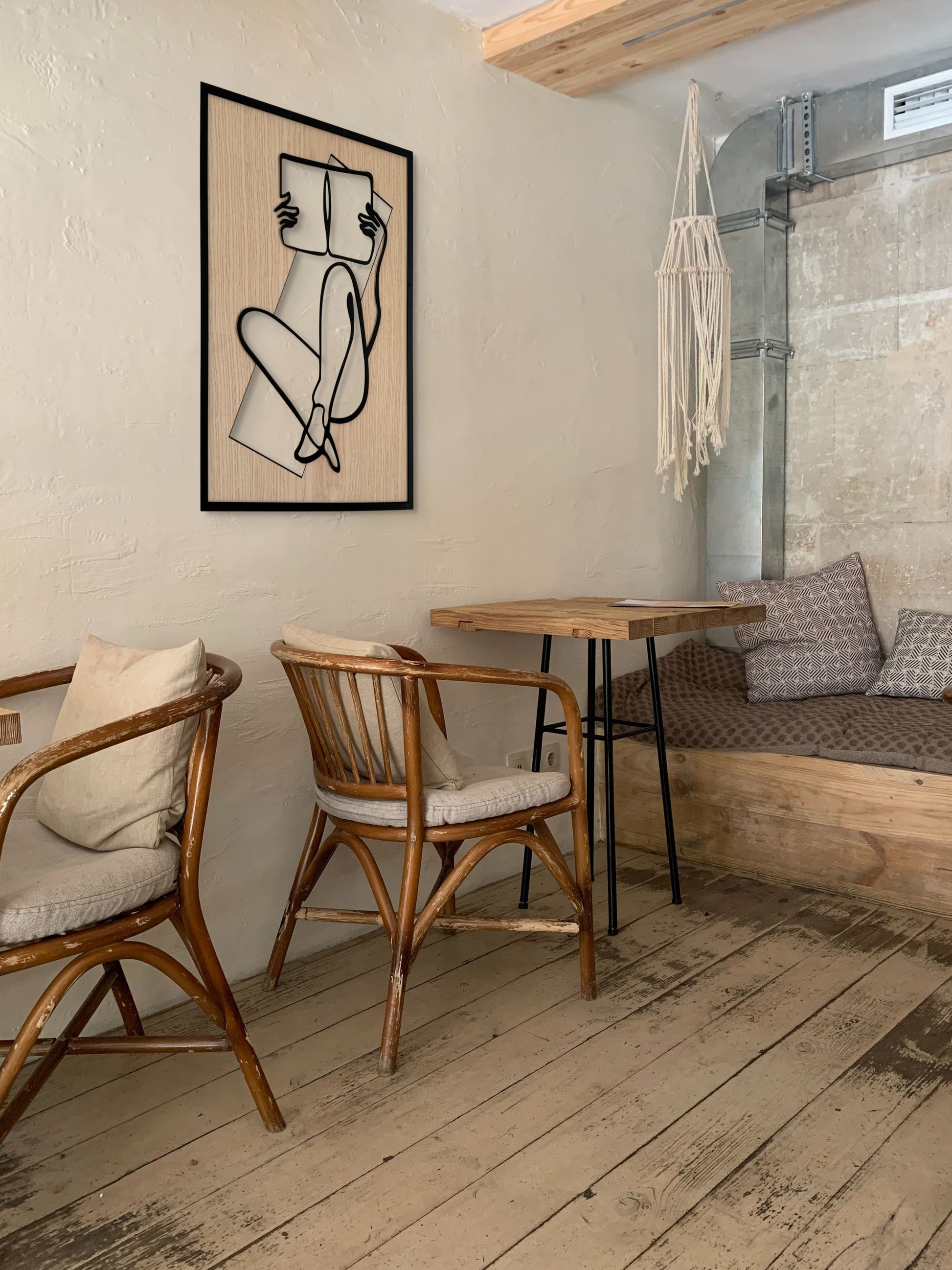 Chapter One wall art in one-line art style featuring a woman reading a book, drawn with minimalist black lines and natural wood tones. Perfect for book lovers, modern, and minimalist decor.
