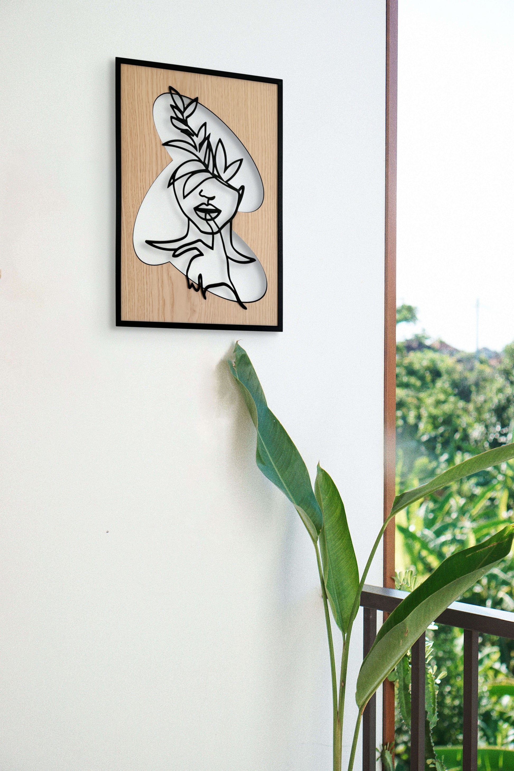 Hidden Voice wall art in one-line art style featuring a woman's face with a finger on her lips, drawn in minimalist black lines with natural wood tones. Ideal for modern and expressive decor.