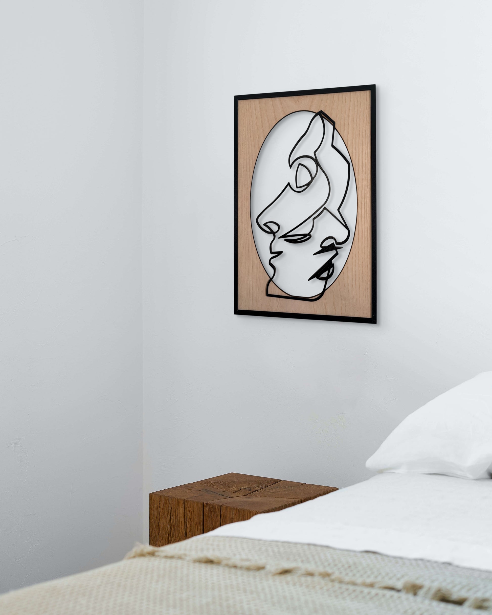 Close Together one-line art wall art featuring two faces gently embracing in a minimalist black line style with natural wood tones. Perfect for modern and romantic decor.