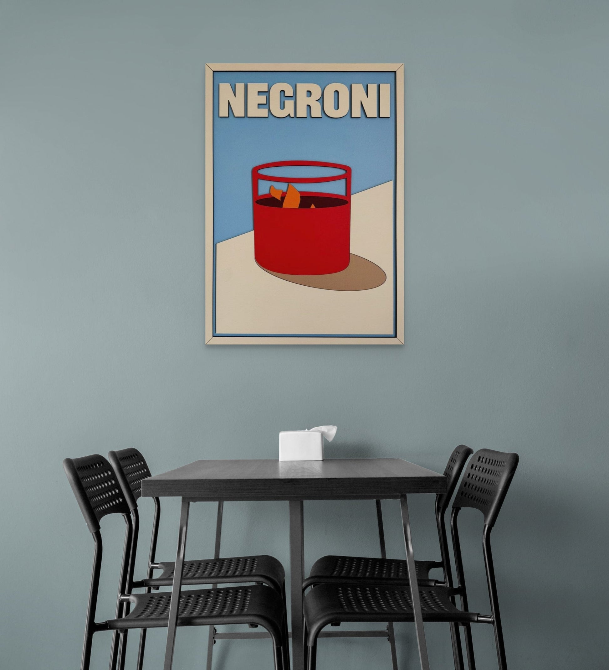 Negroni cocktail wall art in modern minimalist style with bold red drink glass, orange garnish, and blue background – laser cut wooden bar decor sign